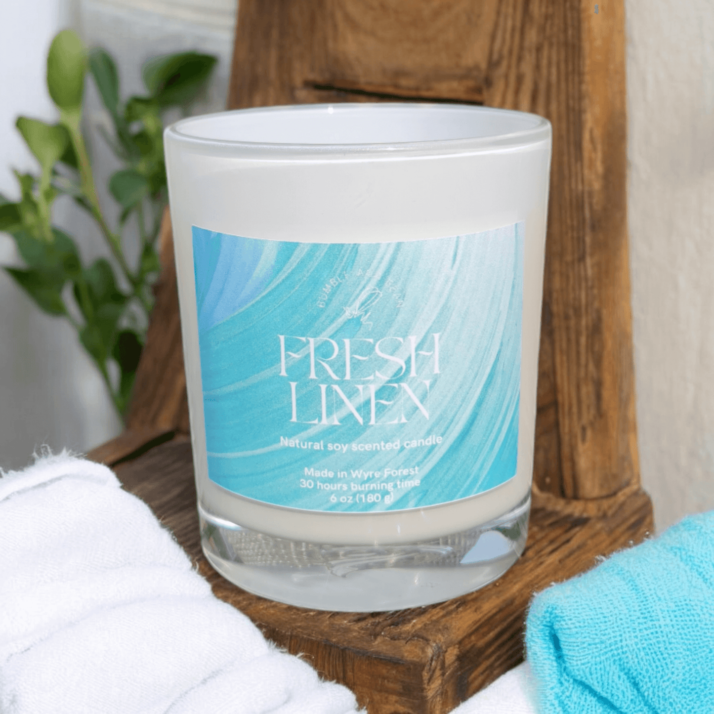 Close-up of fresh linen candle with cotton wick and smooth natural wax
