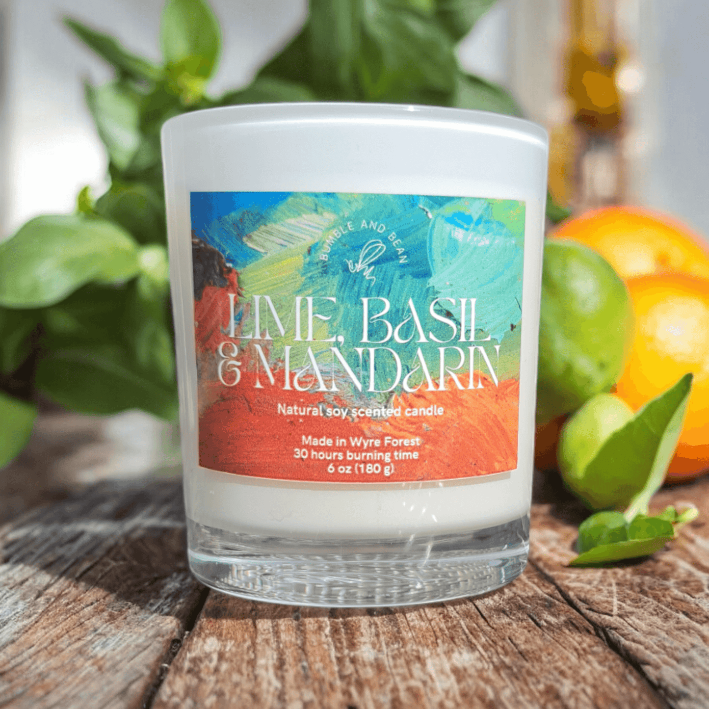 Close-up of Lime Basil and Mandarin candle with cotton wick and smooth natural wax