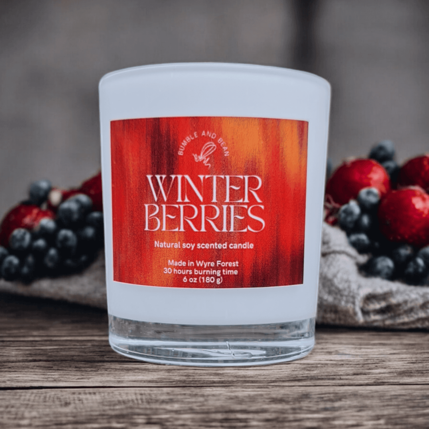 Close-up of Winter Berries candle with cotton wick and smooth natural wax