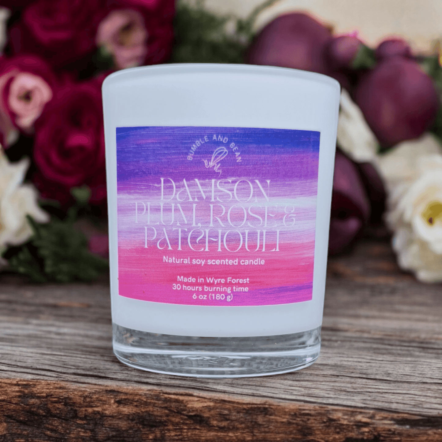 Close-up of Damson Plum, Rose and Patchouli candle with cotton wick and smooth natural wax
