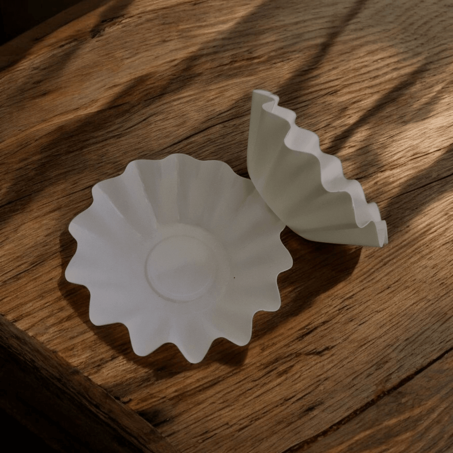 Non-stick wax melt liner placed in electric wax warmer for easy clean up