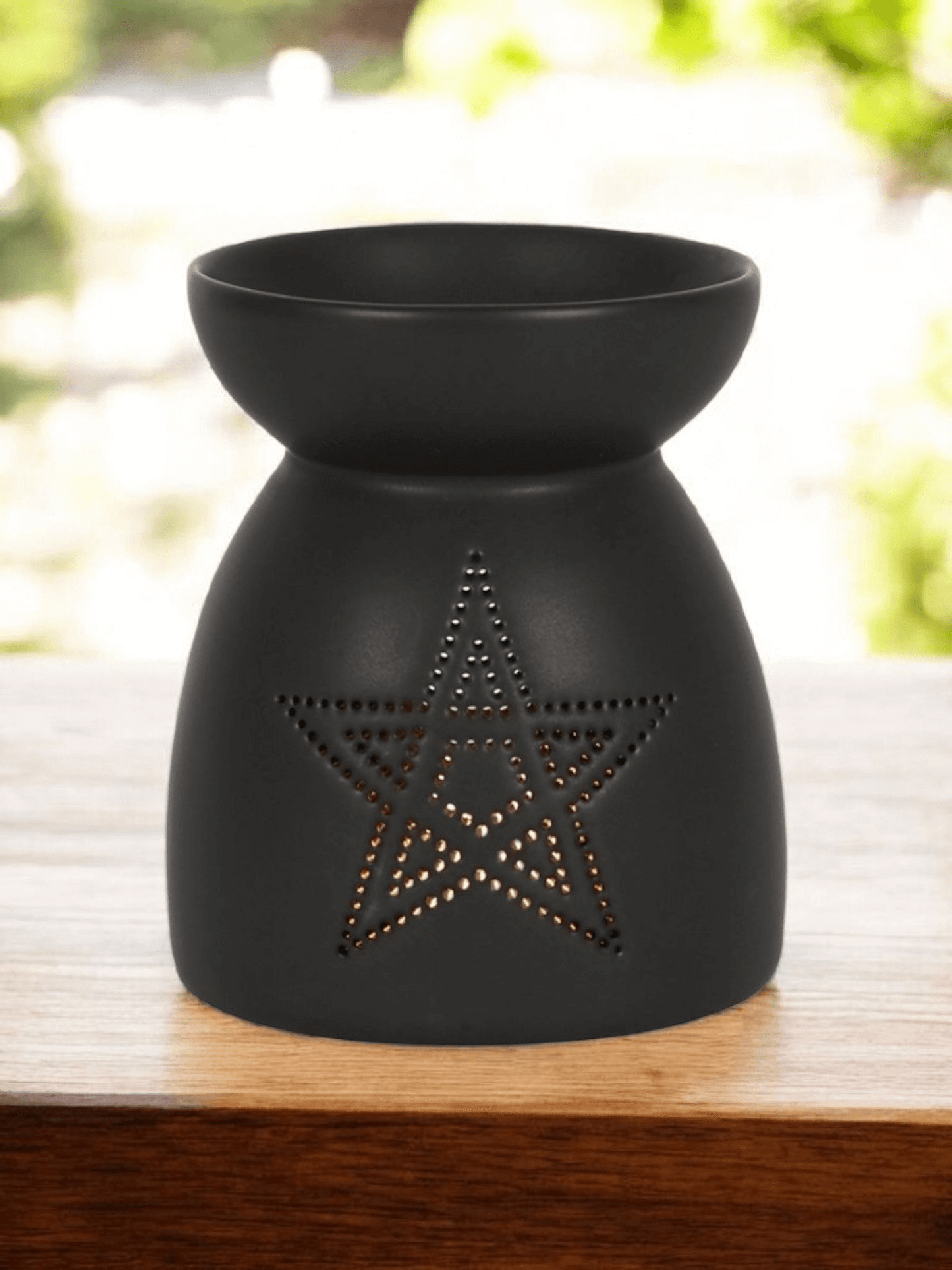 close up of Black pentagram wax melt burner