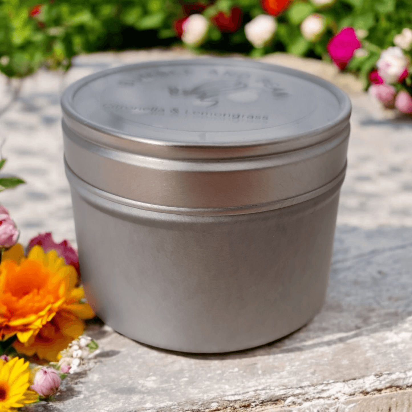 Outdoor citronella candle in silver metal tin for mosquito repellent use