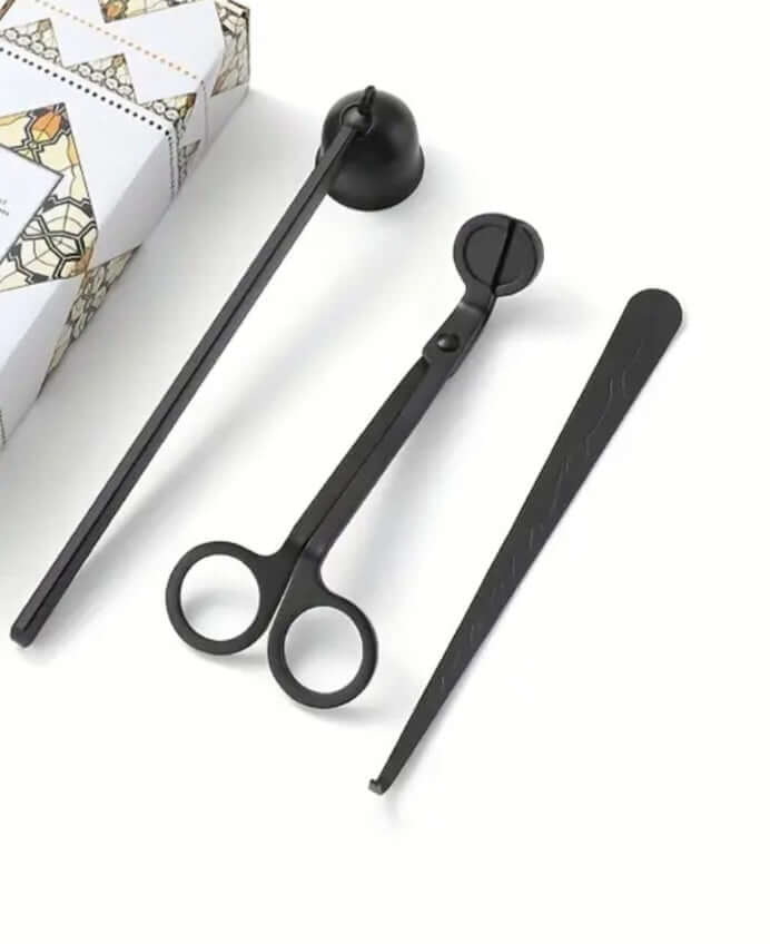 Minimalist black candle snuffer with sleek gift-ready packaging