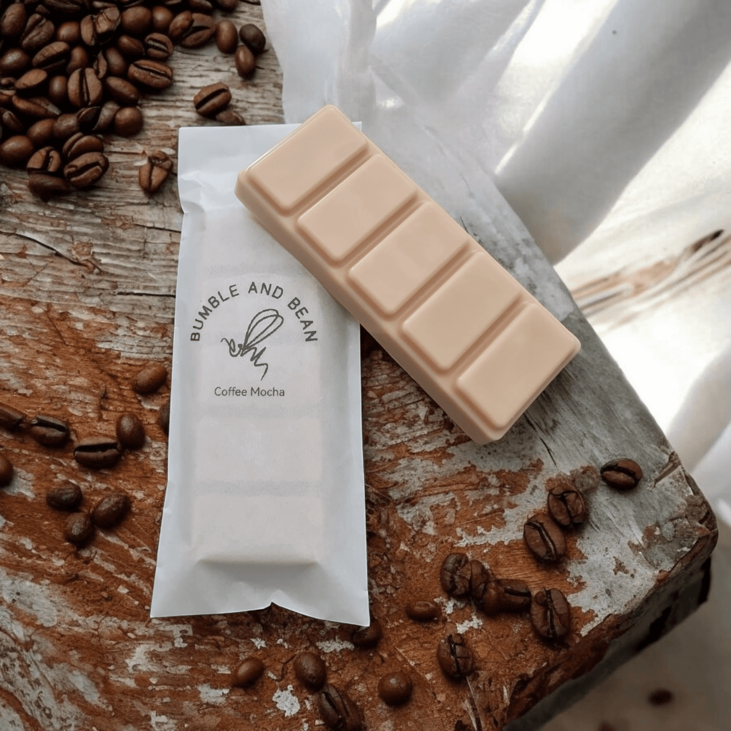 Coffee Mocha wax melts displayed with coffee beans for a cosy, café-inspired home fragrance