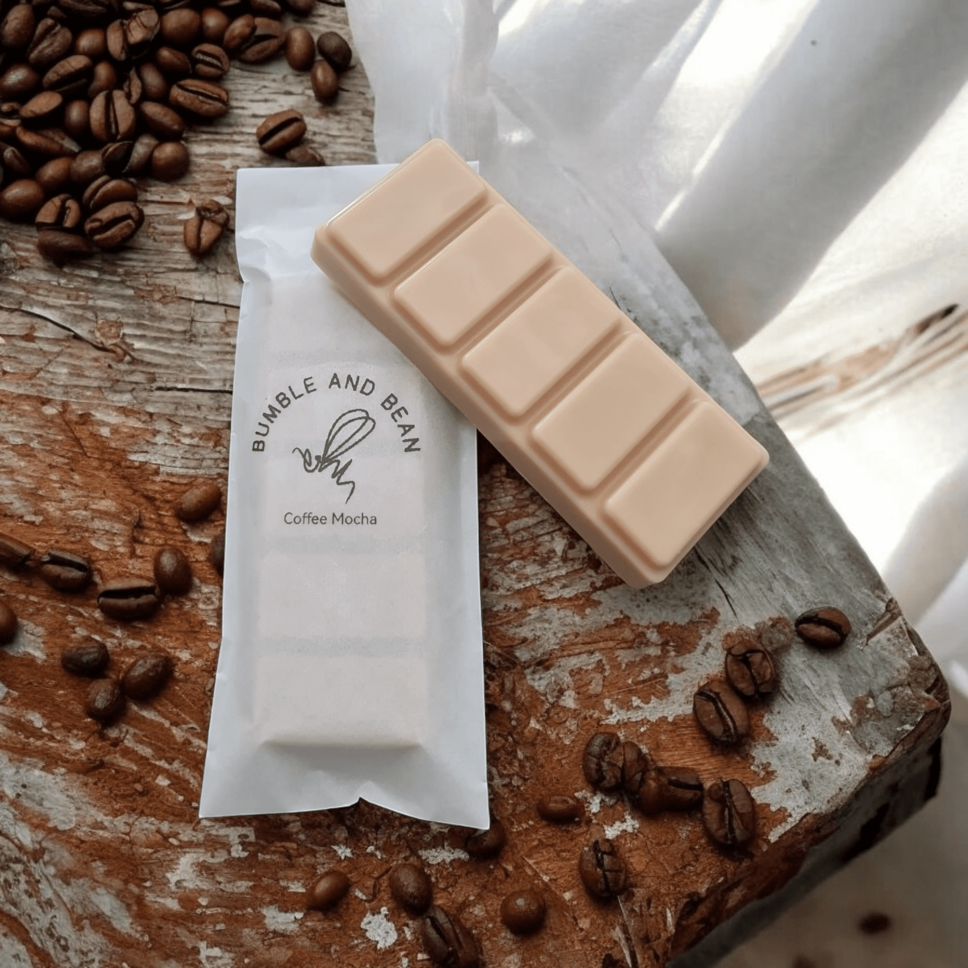 Coffee Mocha wax melts displayed with coffee beans for a cosy, café-inspired home fragrance