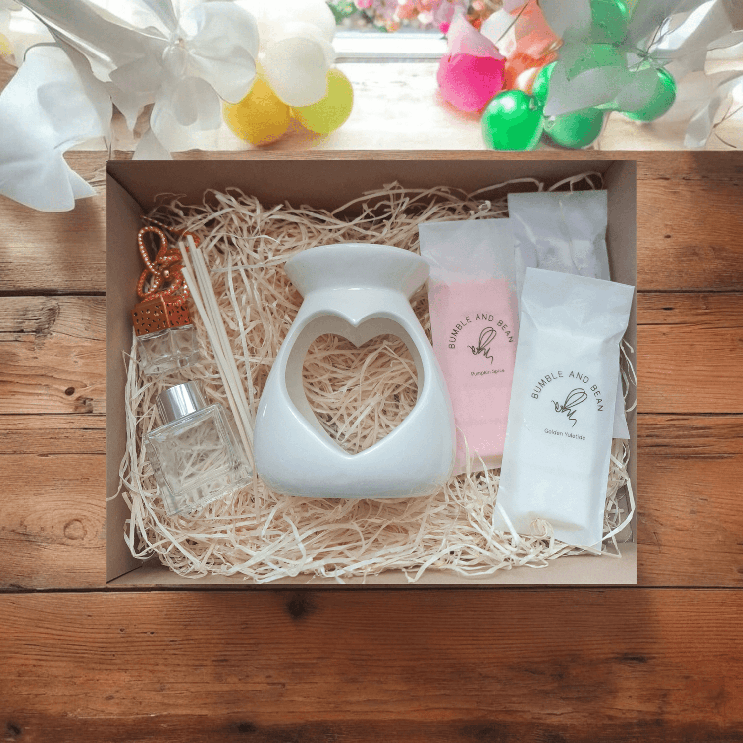 Open large scent gift box showcasing elegant packaging and variety of scented candles and wax melts